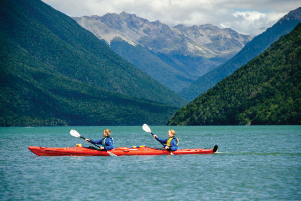 double kayak paddling across lake rotoiti