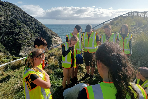 students helping at healthpost nature trust in golden bay