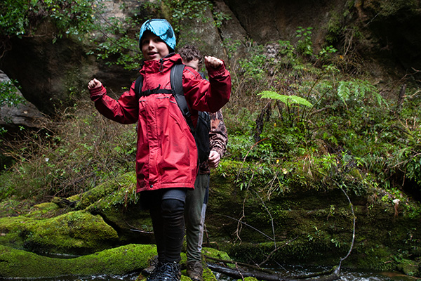 A young adventure feels empowered by his backpacking journey