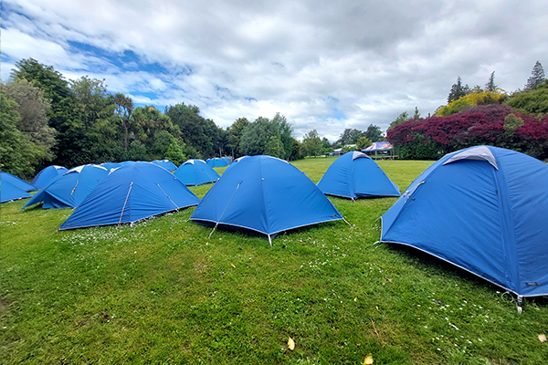 tents set up on site for a camp at Whenua Iti